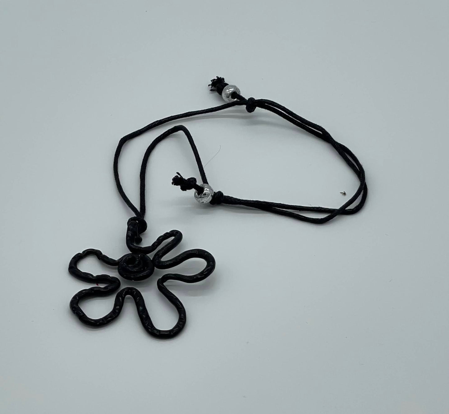 Monochrome flower sketch necklace