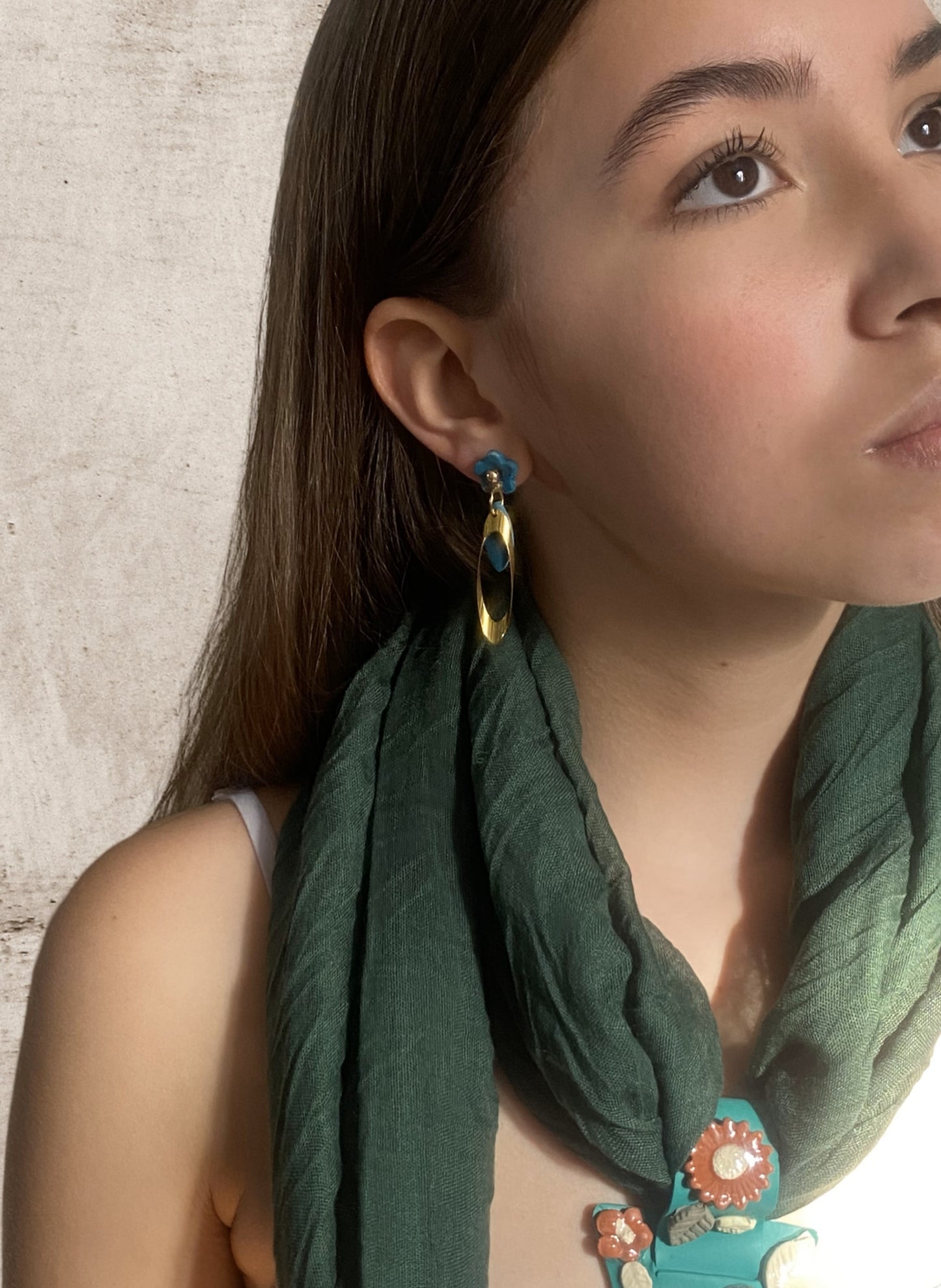 Flower and elongated oval earrings